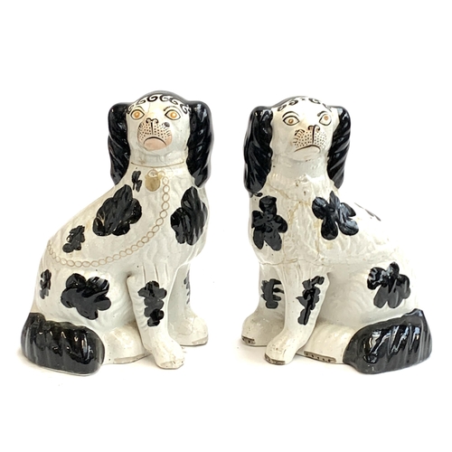 179 - A pair of mid 19th century Staffordshire dogs c.1860 (af), painted with Disraeli curls and blackberr... 