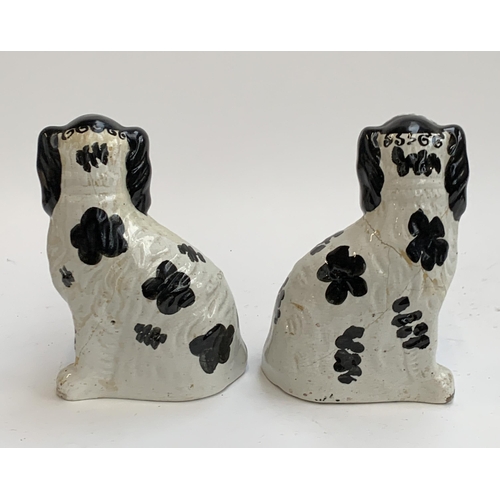 179 - A pair of mid 19th century Staffordshire dogs c.1860 (af), painted with Disraeli curls and blackberr... 