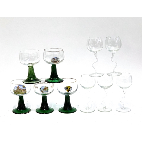 180 - A set of five wine glasses with wiggly stems, each 16cmH; together with five green stemmed hock glas... 