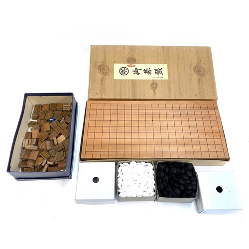 362 - A Chinese Go board game with counters; together with bamboo mahjong pieces