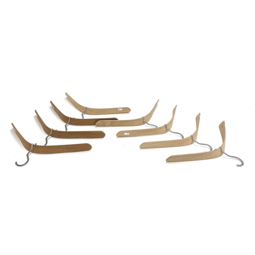 374 - A set of eight Skagerak 'Pilot' coat hangers designed by Nina Tolstrup, stainless steel and bentwood... 