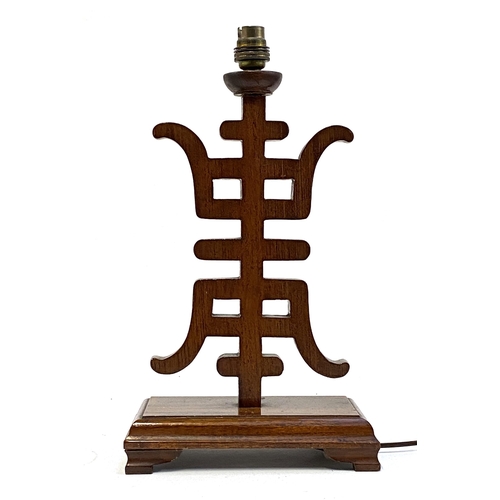 379 - Interior design interest: A Chinese carved wooden table lamp, 39.5cmH