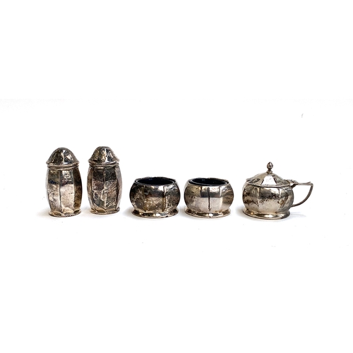 69 - A silver cruet set by Gorham Manufacturing Co, Birmingham 1919, comprising a pair of salts with blue... 