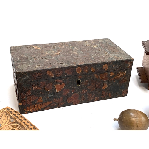 298 - A wooden fern ware style box with applied dried fern, 23cmW; turned treen apple; money box etc