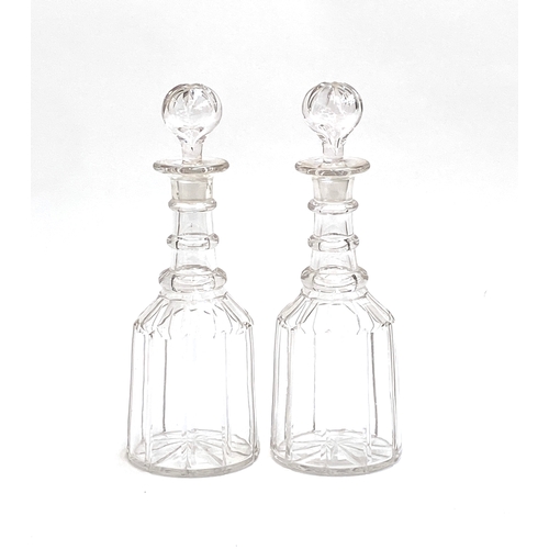 164 - A pair of 19th century cut glass decanters with anulated collars, 31cmH