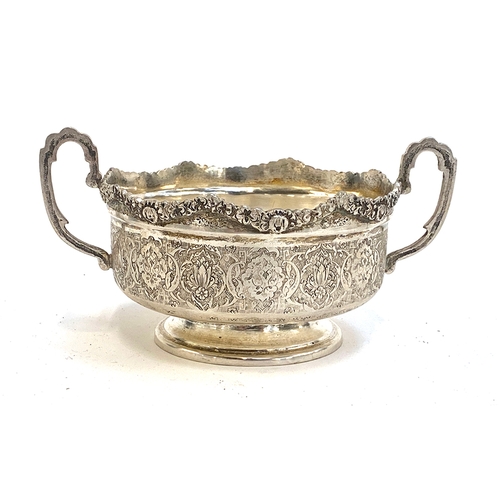 75 - A Persian silver twin handled bowl, chased rim, the sides worked with intricate patterns, stamped '8... 