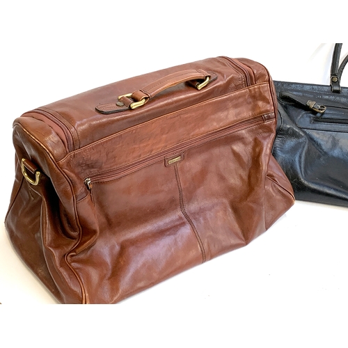 386 - A brown Hidesign leather bag, approx. 53cmW; together with a black leather Dericci holdall, approx 6... 