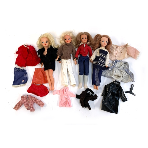 406 - Four vintage Pedigree Sindy dolls, together with a small quantity of genuine Sindy branded clothes