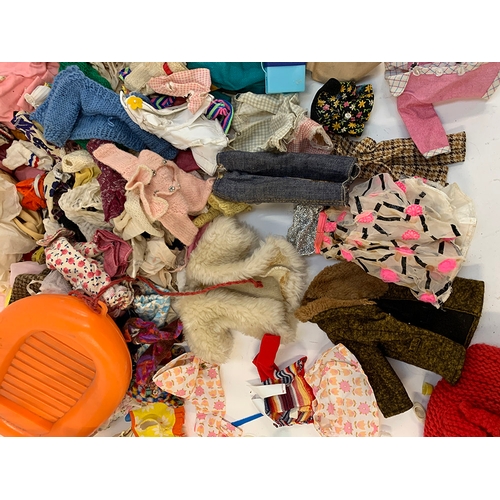 409 - A large quantity of vintage dolls clothes and accessories, possibly, Sindy, Barbie, Pippa or Mary Qu... 