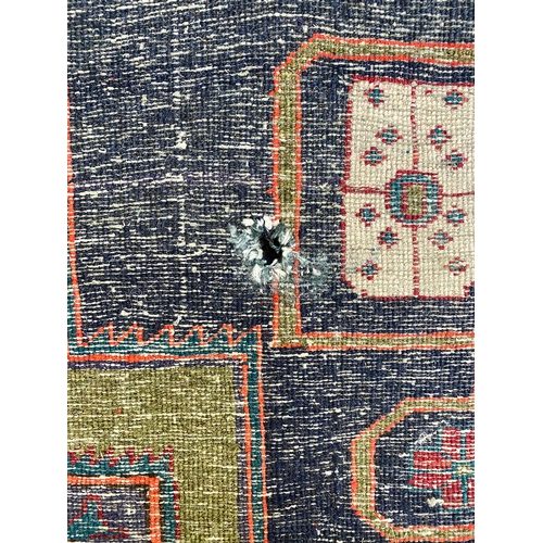 1129 - A dark blue runner rug, 330x116cm