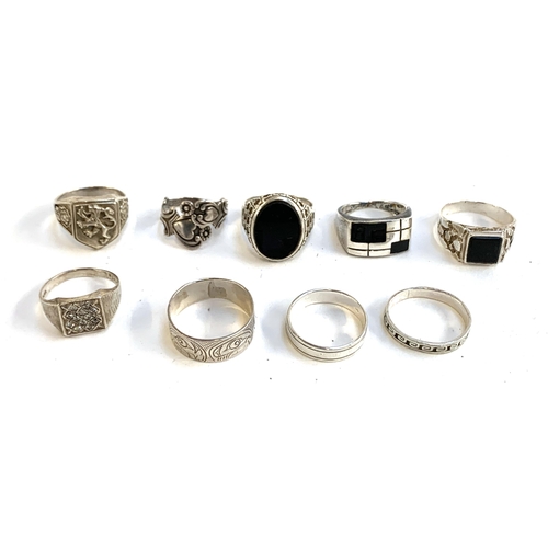 11 - A quantity of 925 silver and white metal rings, some set with onyx, gross weight 55g