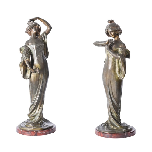 491 - A pair of Art Nouveau spelter figures after Lucien Charles Alliot, Edelweiss, the maiden displayed i... 