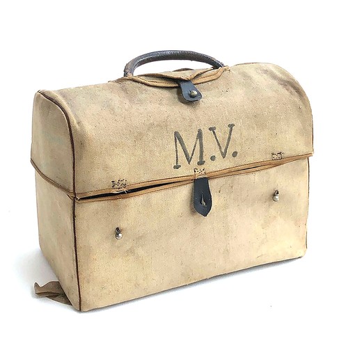 499 - A gent's leather vanity case, with canvas cover, containing a quantity of spirally fluted pots and j... 