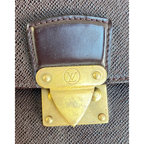 481 - A Louis Vuitton leather wallet, with brass fittings, missing key, 38x28cm