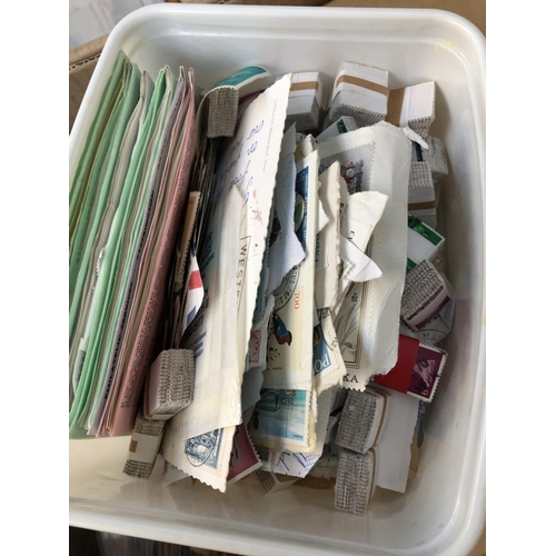 530 - A large quantity of stamps and accessories in four boxes to include loose stamps, stock books and al... 