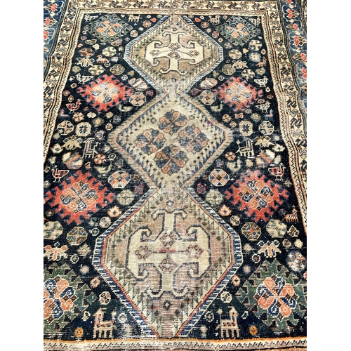 1139 - A Persian tribal rug, approx. 168x129cm