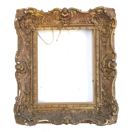 945 - A 19th century gilt gesso Rococo style frame with shell cresting, overall 59x51cm rebate dimensions ... 