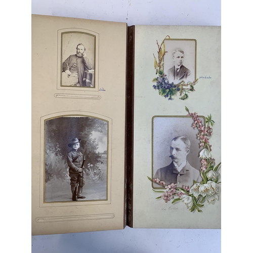 534 - A Victorian photograph album containing a quantity of black and white photographs, late nineteenth a... 