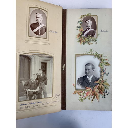 534 - A Victorian photograph album containing a quantity of black and white photographs, late nineteenth a... 