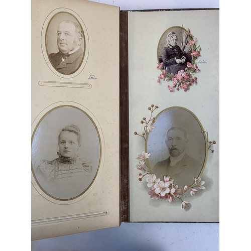 534 - A Victorian photograph album containing a quantity of black and white photographs, late nineteenth a... 