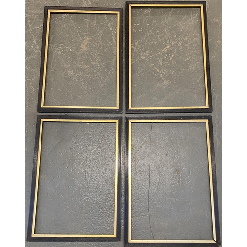 1015 - Four ebonised picture frames with gilt slip, rebate sizes 69x47.5cm and 74x49.5cm