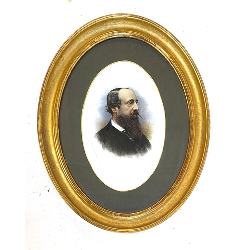 882 - A 19th century portrait on porcelain of a bearded gentleman (af), in gilt gesso oval frame, 28x18cm