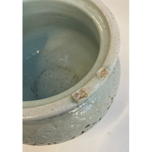 262 - A Chinese blanc de chine porcelain censer (af), of pierced form, the lid surmounted by a foo dog, 38... 