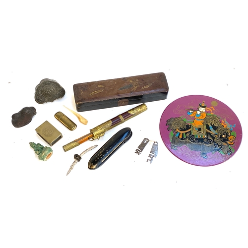 587 - A mixed lot to include lacquered pen box, Mongolian circular wall plaque, Chinese matchbox case, etc