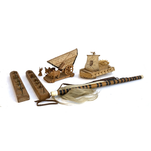 592 - A mixed lot of mainly wooden items, to include model oxen and cart; model raft; fly swat; carved woo... 