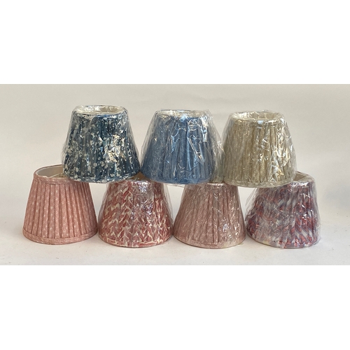 602 - Seven Fermoie lampshades, six new in wrapping, 13cmH, 15.5cmD