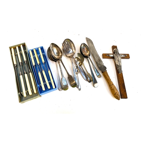 118 - Two boxes of resin handled stainless steel knives, plated flatware, and a crucifix