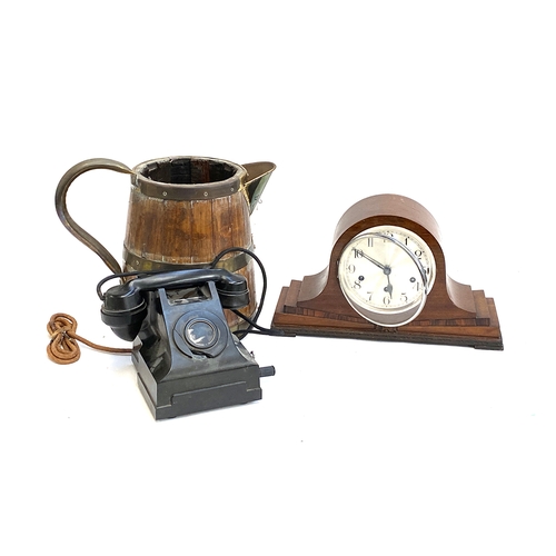 643 - A vintage rotary dial telephone; a T. Wickenham mantel clock; and a large coopered wooden jug