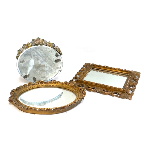 667 - Three mirrors: a rectangular pierced acanthus framed mirror 42x37cm, together with one with floral p... 