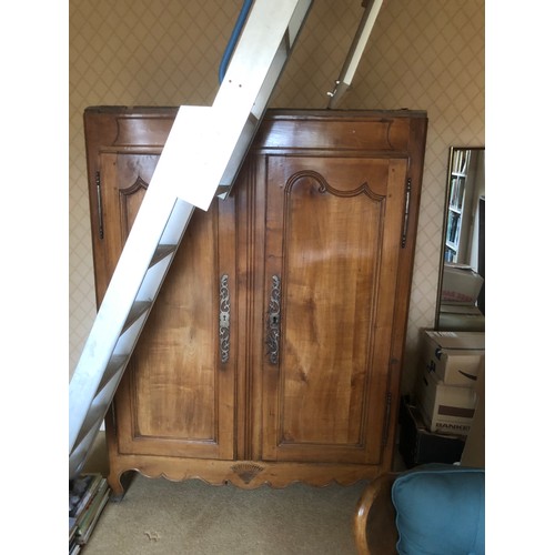 1547 - A small French provincial fruitwood armoire with two doors