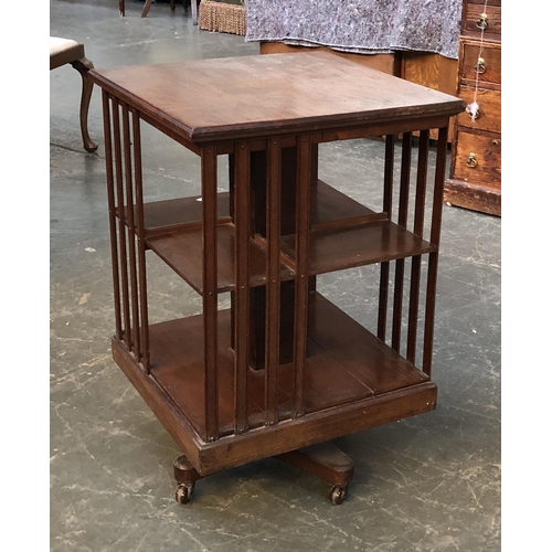 1280 - An Edwardian rotating mahogany bookcase, on ceramic casters, 50x50x75cmH