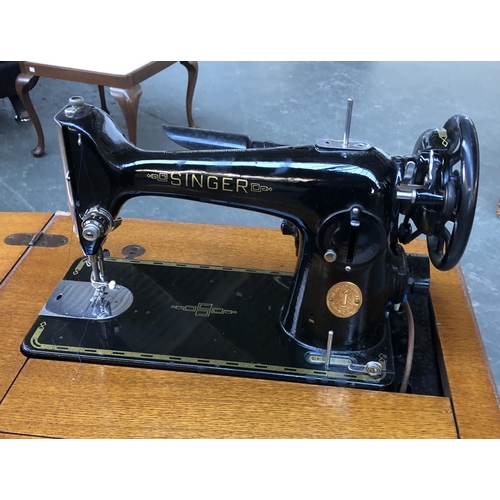 1281 - A Singer sewing machine and table, 50x43x84cmH (when closed)