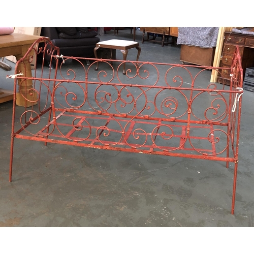 1542 - A folding red painted wrought iron day bed, 140cmW