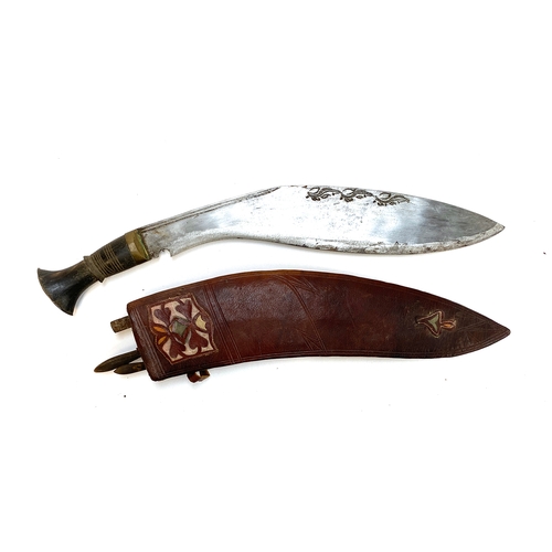 548 - A large kukri knife, in leather sheath, 43cm long overall