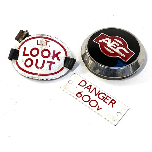 568 - Two small vintage signs, 'Danger 600v', 11x4cm, 'L.T Look Out', 11x8cm, and an AEC Associated Equipm... 