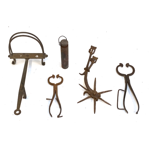 507 - A collection of metal items to include steel sugar loaf cutters; spur; weight; possible horseshoe re... 