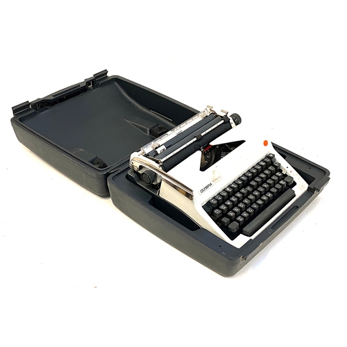 513 - An Olympia typewriter in plastic carry case