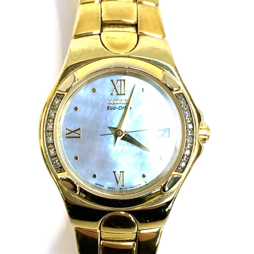 152 - A ladies Citizen Eco-Drive watch, with mother of pearl face, diamond set bezel, the dial 18mmD