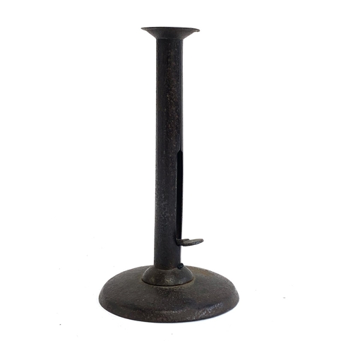 306 - A 19th century hogscraper type ejector candlestick, 20cm high