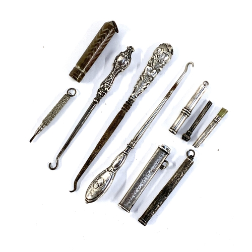 85 - A mixed lot to include silver handled button hooks, various propelling pencil parts etc