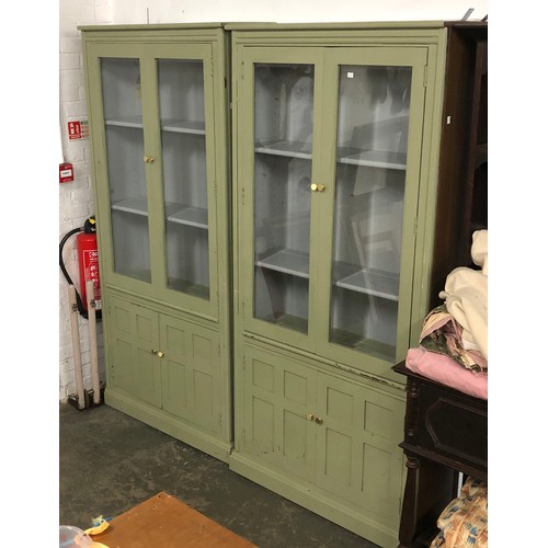 1531 - A pair of Ercol green painted elm glazed cabinets, with cupboards below, 95x34x197cmH