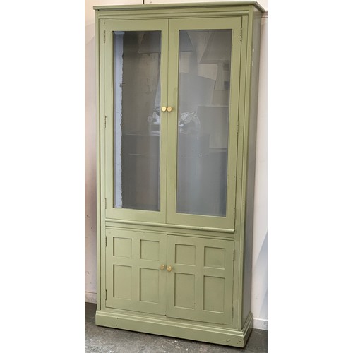 1531 - A pair of Ercol green painted elm glazed cabinets, with cupboards below, 95x34x197cmH