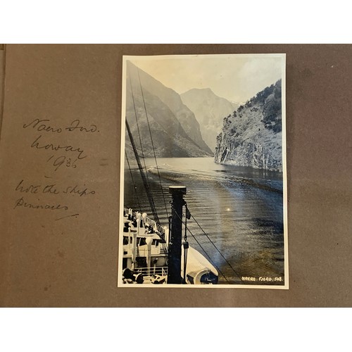 557 - An early 20th century photograph album c.1920 containing approx. 150 black and white photographs, po... 