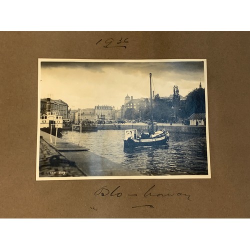 557 - An early 20th century photograph album c.1920 containing approx. 150 black and white photographs, po... 