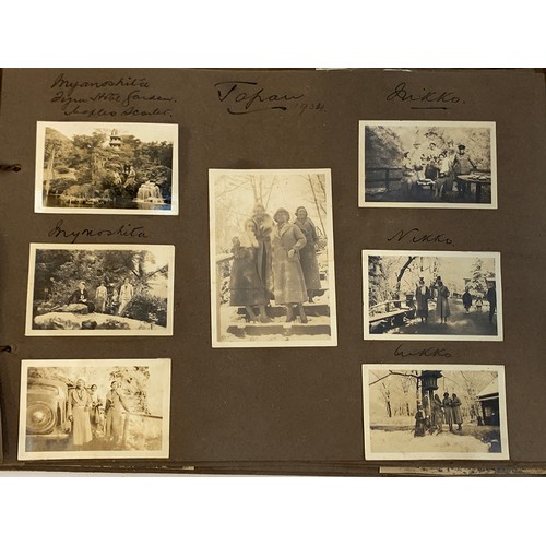 557 - An early 20th century photograph album c.1920 containing approx. 150 black and white photographs, po... 