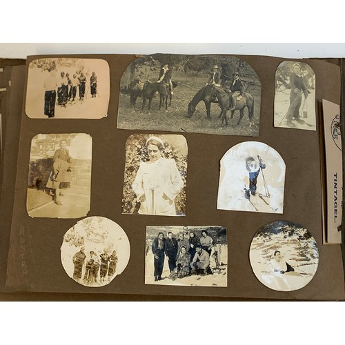 557 - An early 20th century photograph album c.1920 containing approx. 150 black and white photographs, po... 